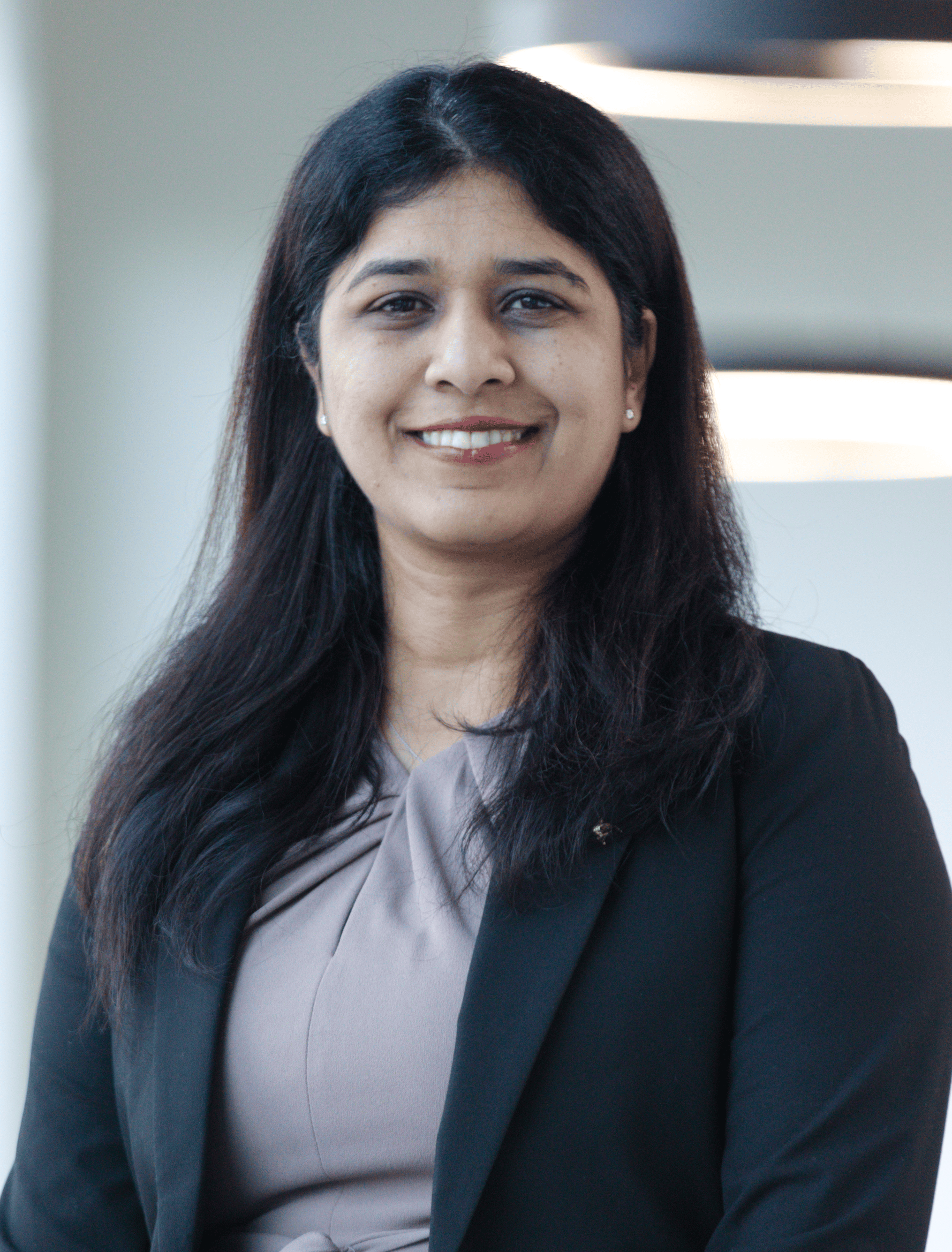 Angela Paulmony, Human Resources Head for Techwave seen posing for a photo with a bright smile on her face